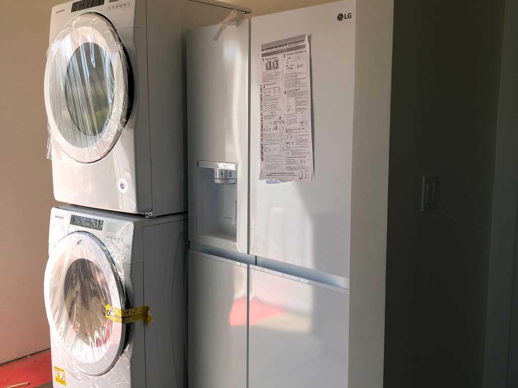 a2mContractors finished kitchen with new appliances