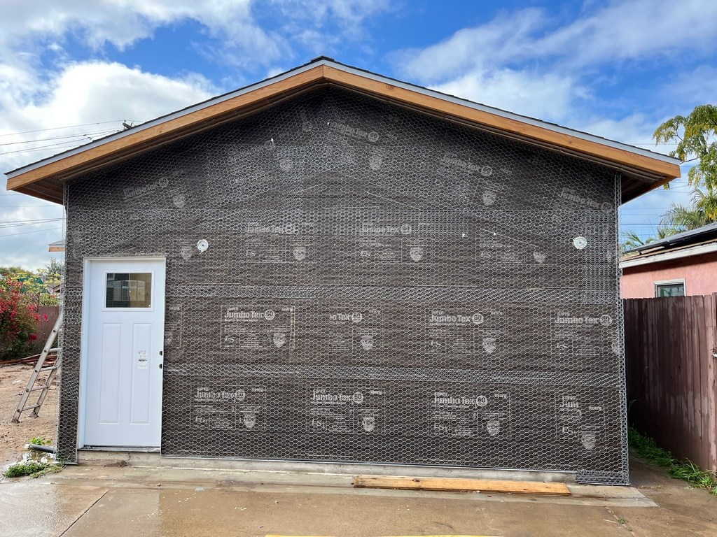 ADU exterior shear wall with housewrap and door installed.