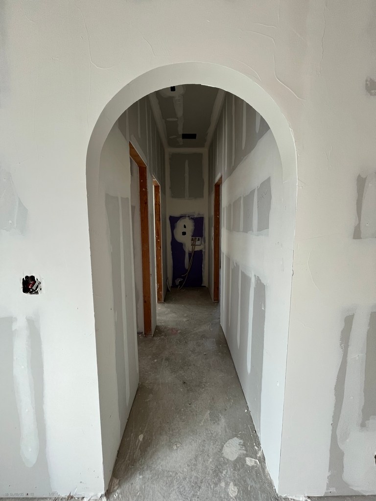 ADU arched hallway drywall finish