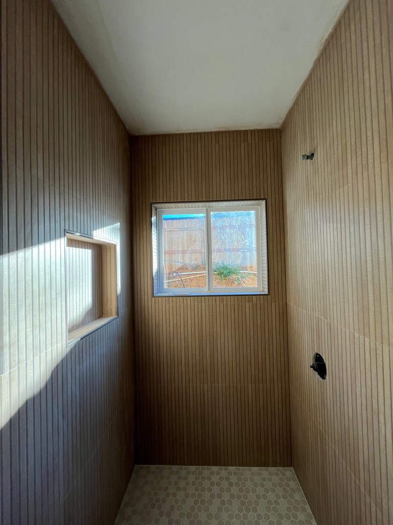 Vertical shower wall tile