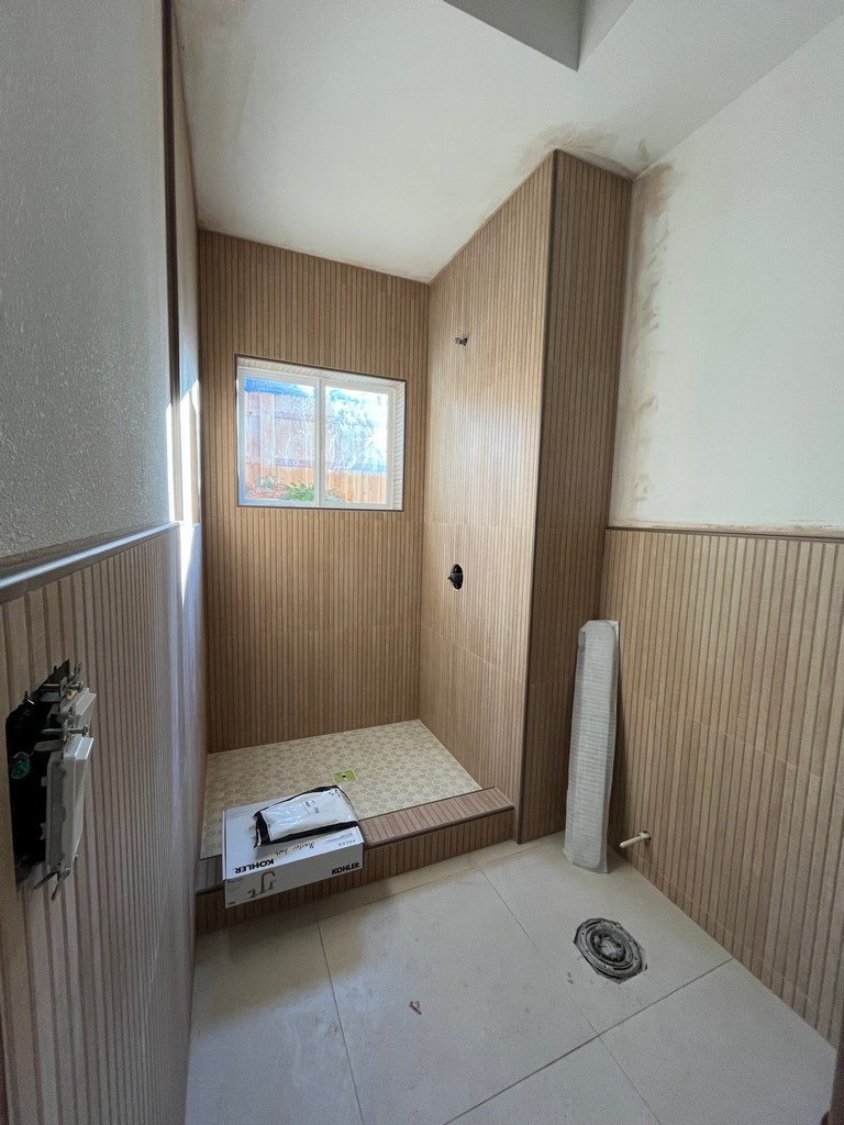 Walk-in shower tile finish