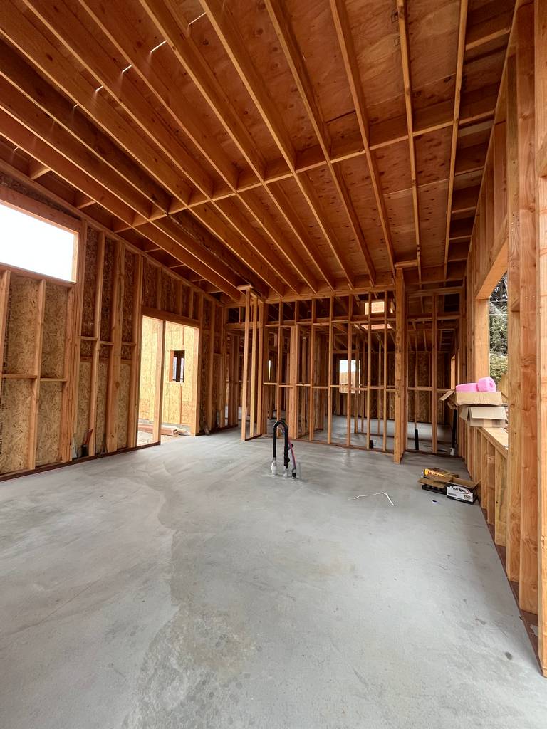 Framed window opening and wall studs.