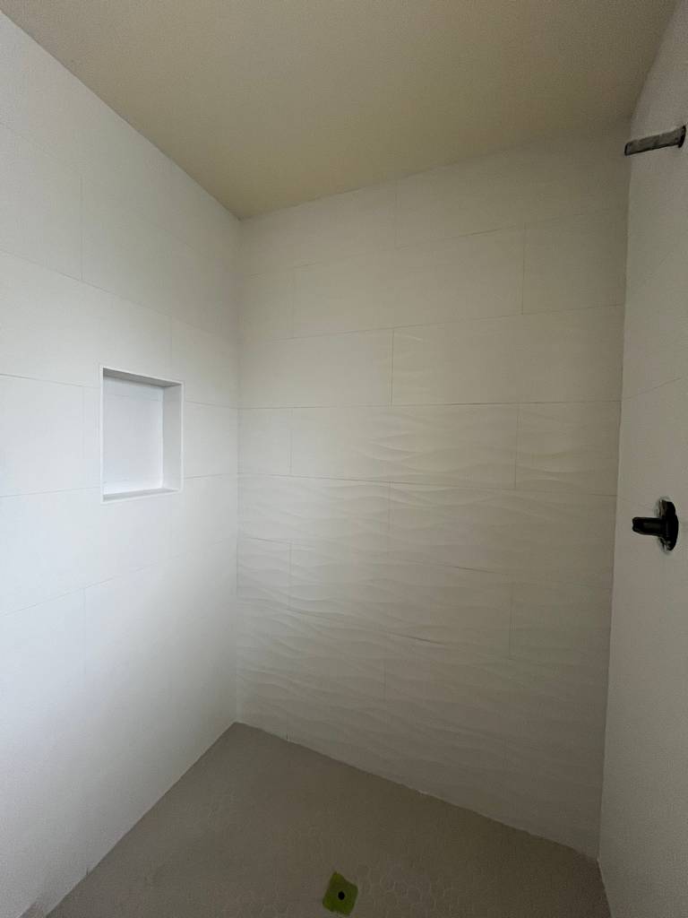 Shower shelf insert grouting preparation