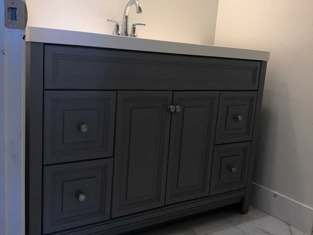 ADU showing beautiful marble tile in the walk-in shower