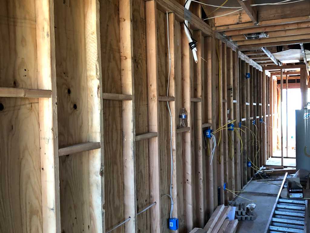 ADU inside wall showing electrical conduits and outlets