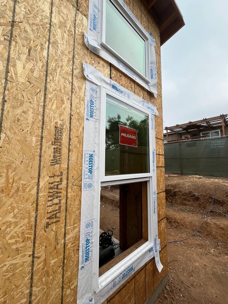 Detailed view of window frame installation during remodel.