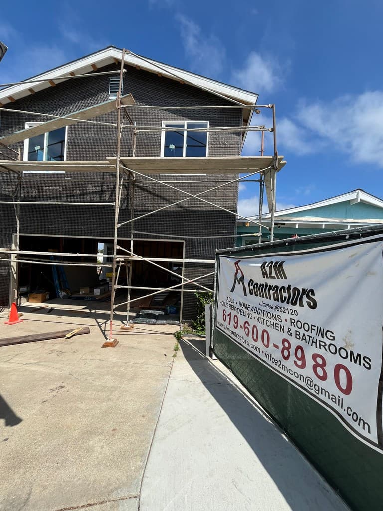 Garage ADU with vinyl windows and exterior lath.