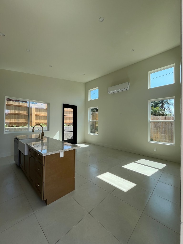 Open living room and kitchen interior.