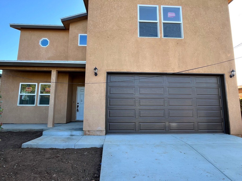 2 Stroy build showing front exterior elevation with finished stucco