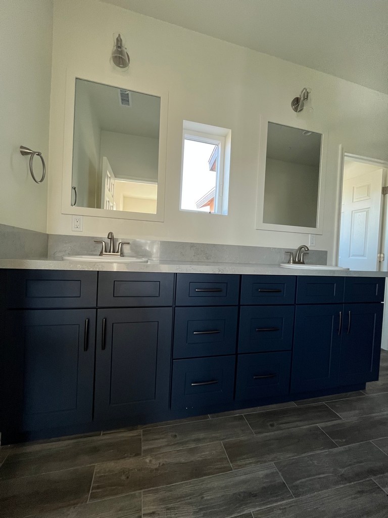 Double vanity with quartz countertop.