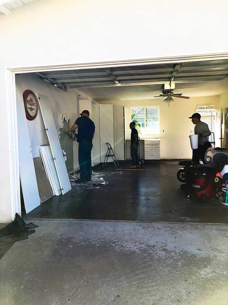 garage conversion showing demolition of the drywall