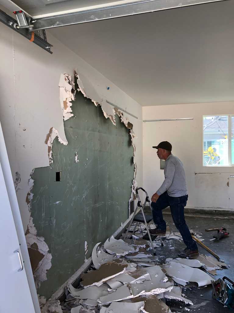 garage conversion drywall pieces from the old wall