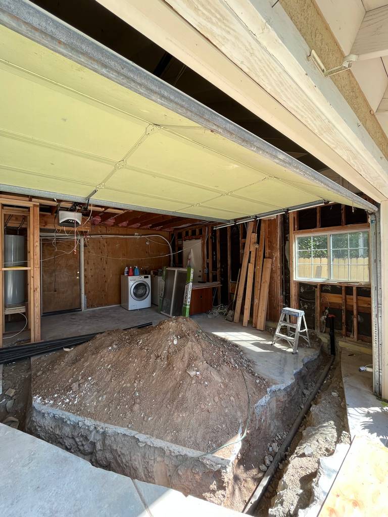 garage conversion cutting the concrete utility path.