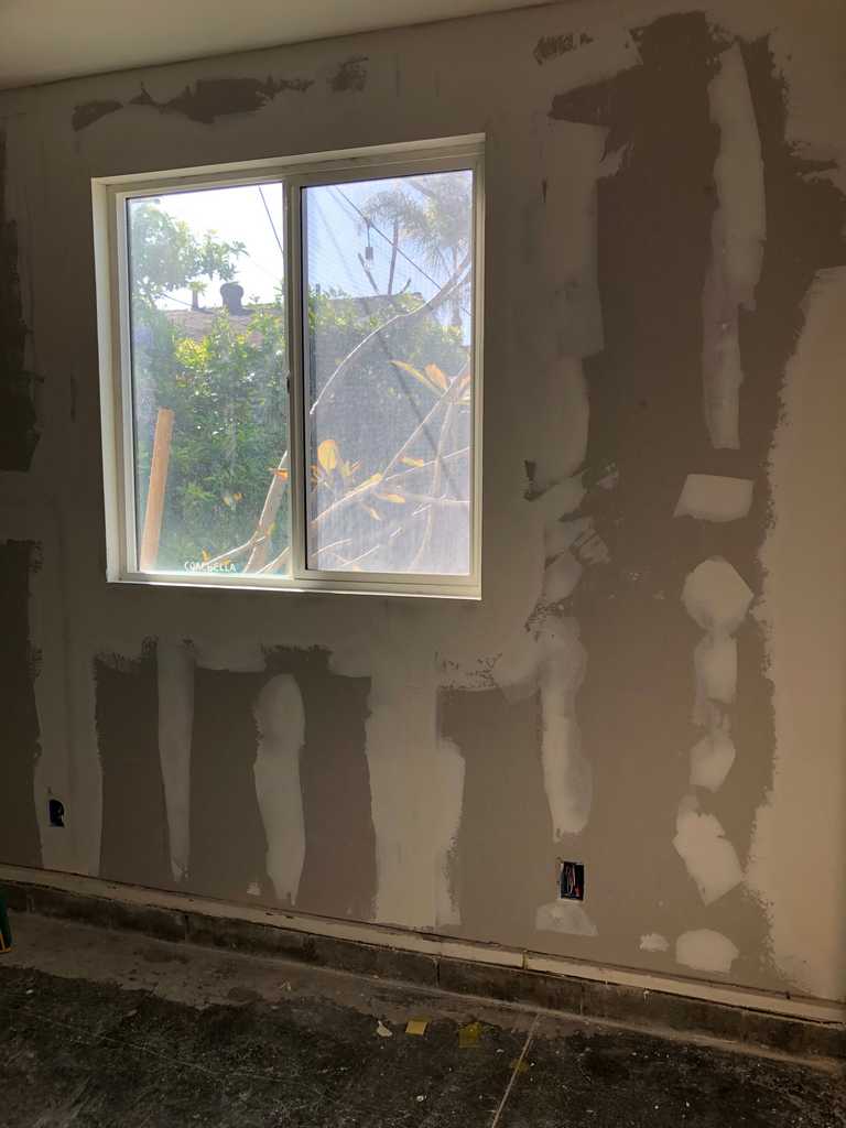 garage conversion drywall mud is applied