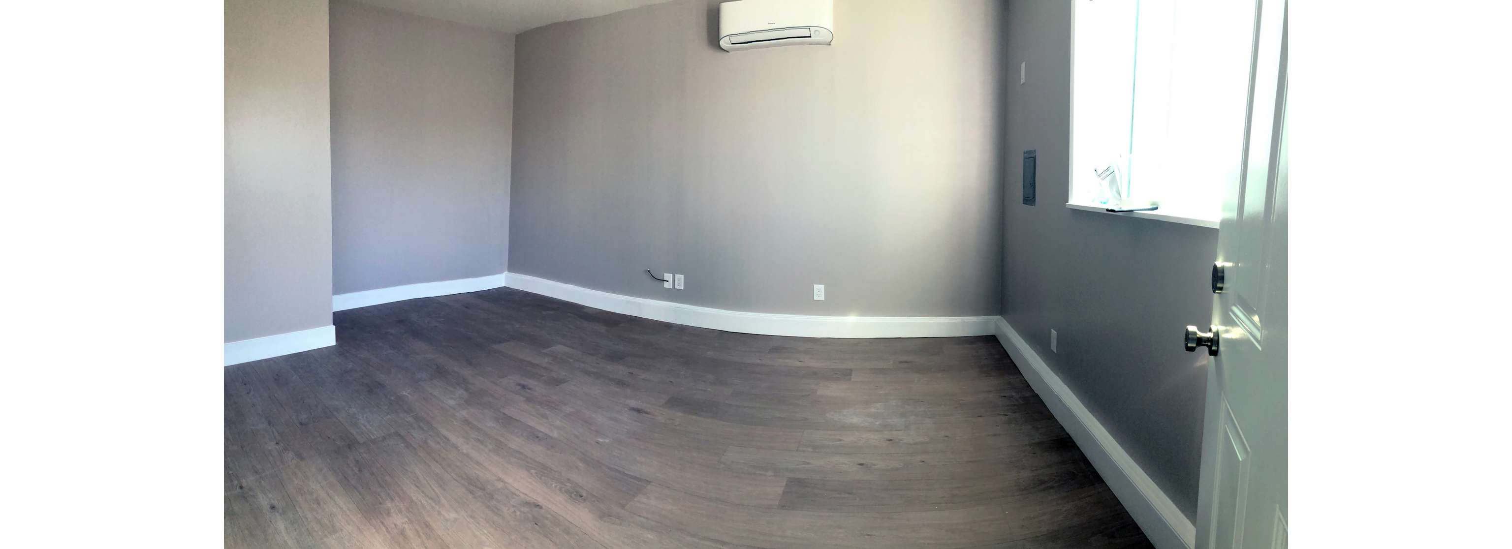 Garage conversion showing new pergo floor and finished walls