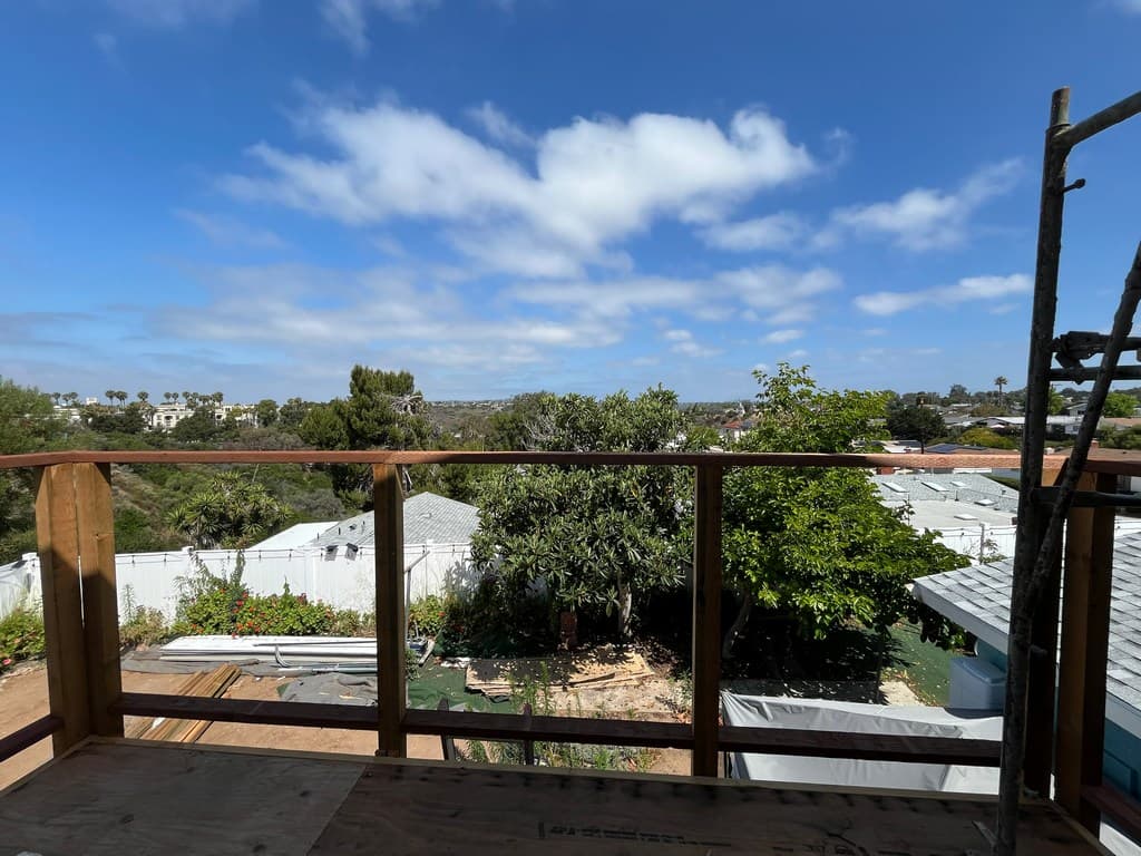 Framed ADU balcony with neighborhood view.