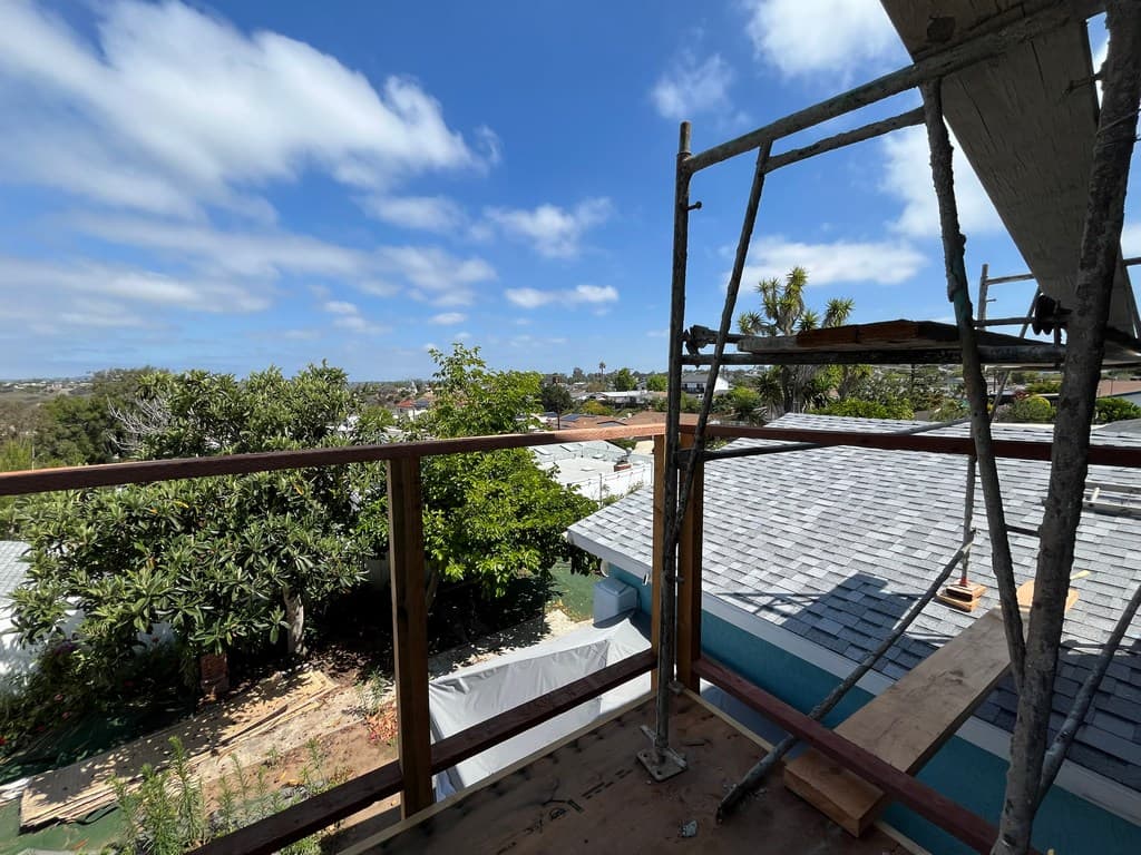 ADU balcony framing with scaffold access.
