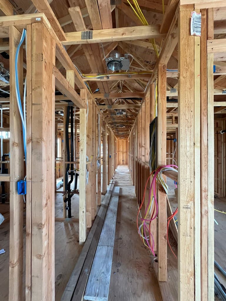 ADU hallway framing with rough electrical wiring.