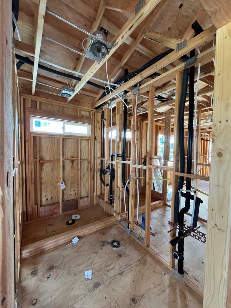 ADU bathroom framing with plumbing rough-in.