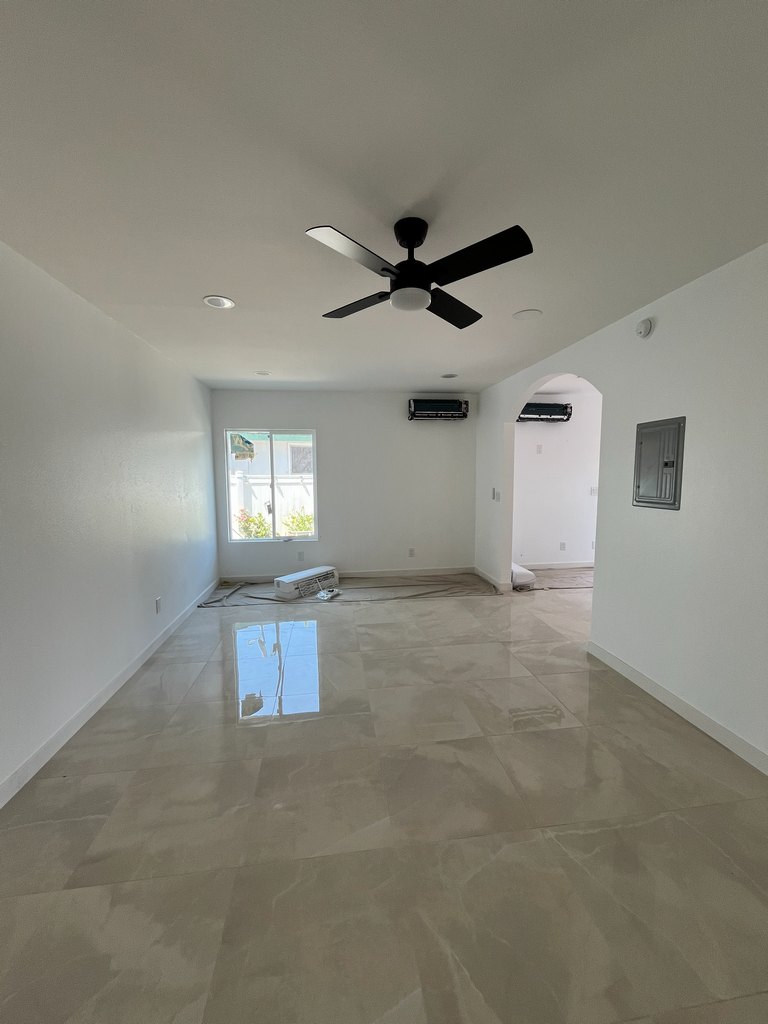 Finished living area with ceiling fan and mini-split