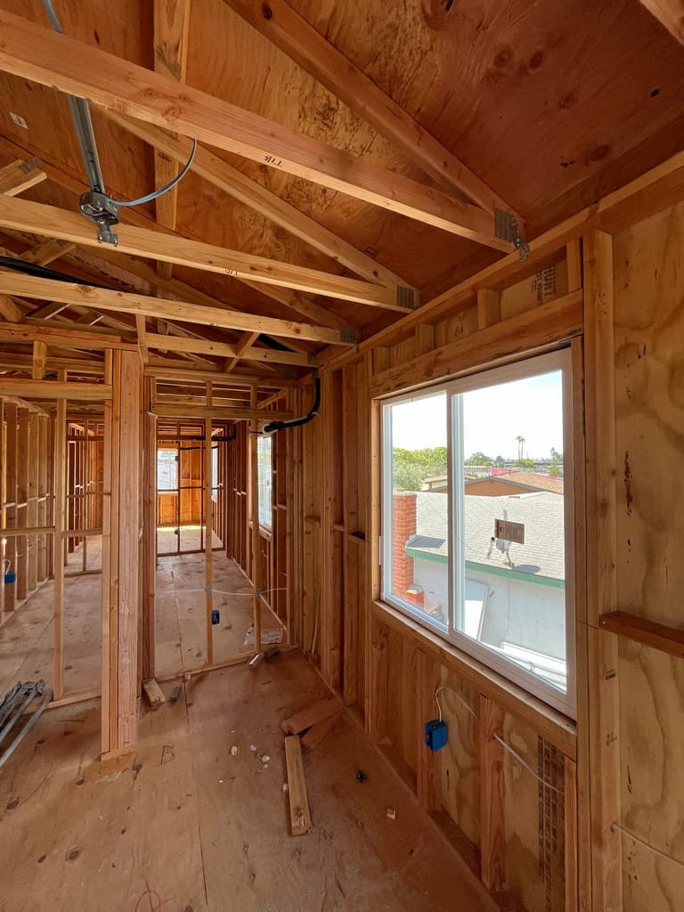 ADU vinyl window with rough electrical framing.
