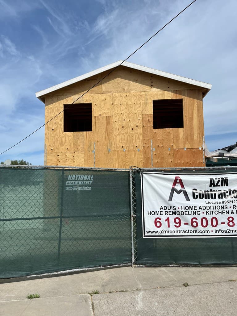 Exterior ADU sheathing with framed window openings.