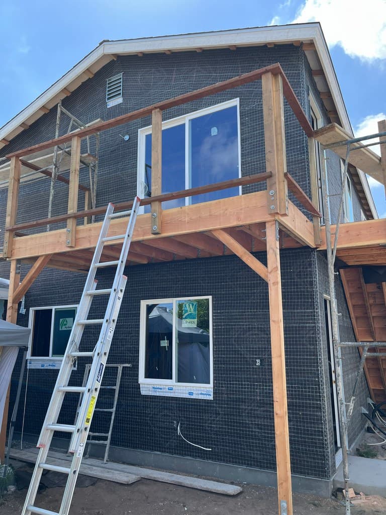 ADU balcony framing with vinyl windows.