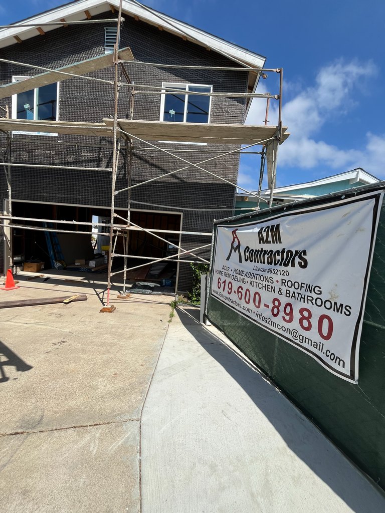 scaffolded guest house exterior prepared for stucco