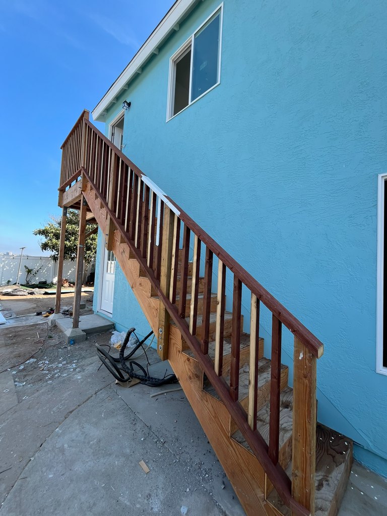 wood stair railing and upper landing