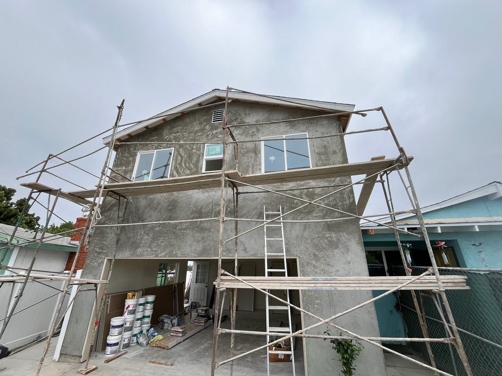 tucco base coating across the two-story guest house