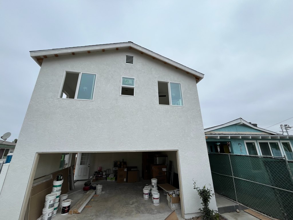 textured stucco, installed upper windows, roof ventilation