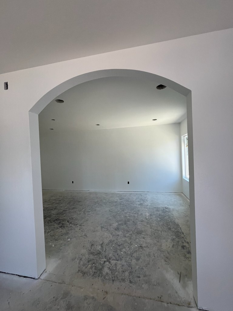 Interior view through a finished architectural archway