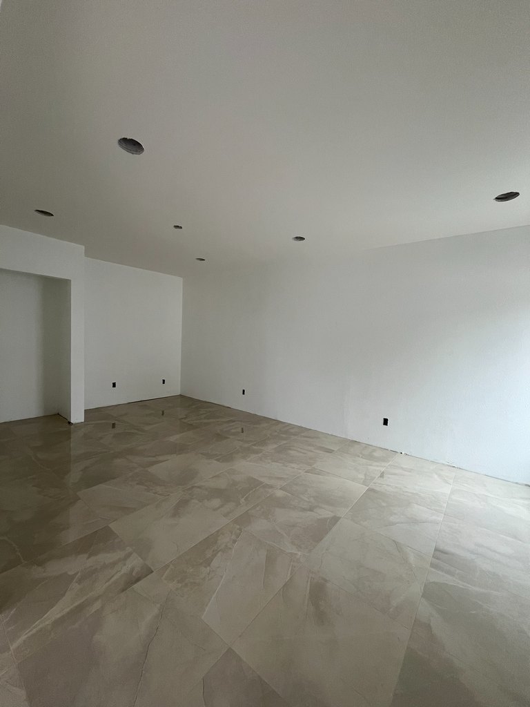 Interior room after installation of glossy large-format floor