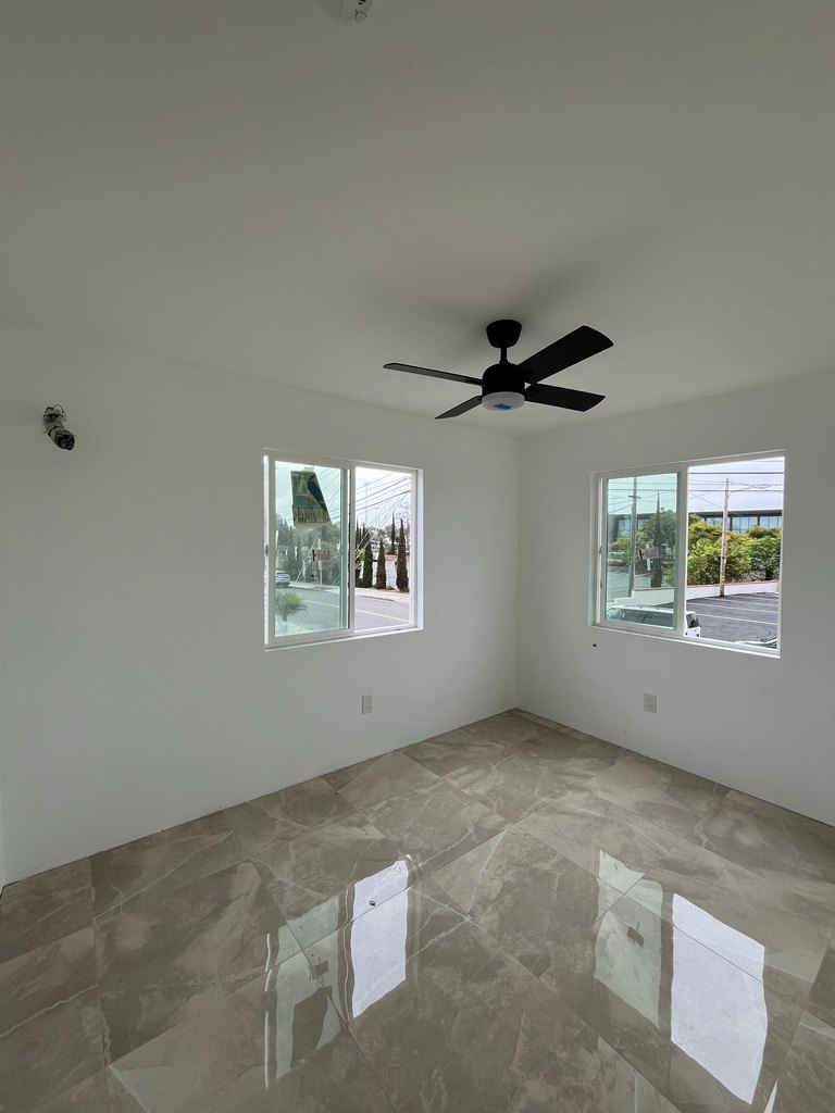  two windows, reflective tile flooring