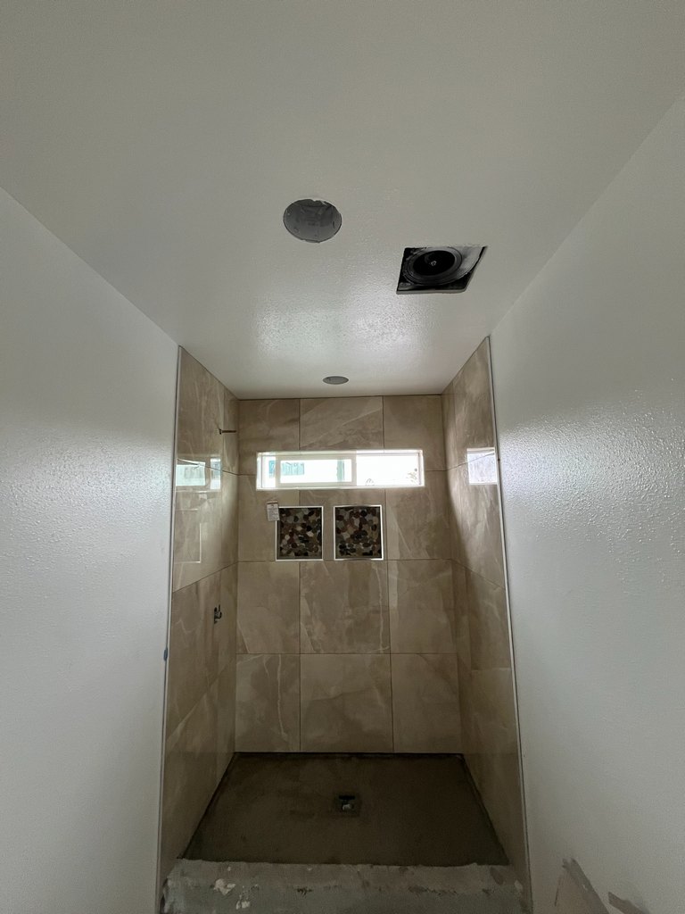 Tiled shower enclosure awaiting final fixtures