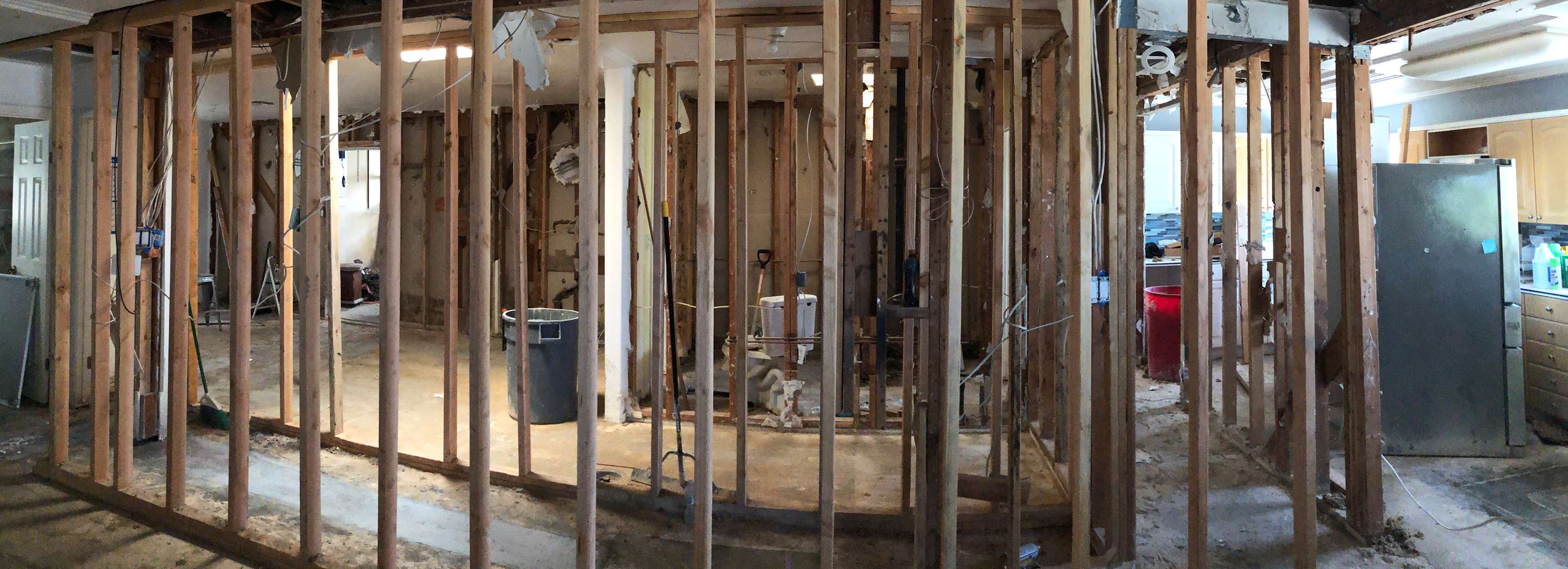 panoramic-view-of-inside-stud-walls-of-home-remodel