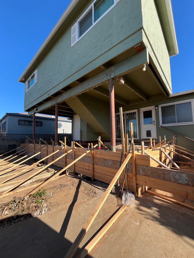 Wide view of footing formwork layout defining new addition footprint and structural boundaries.
