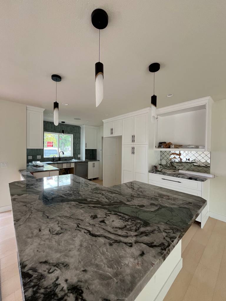 ** L-shaped island with quartz countertop