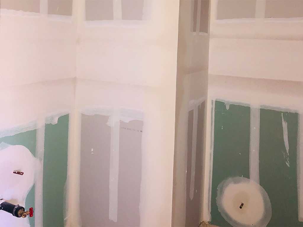 ADU-showing-taped-and-mudded-green-board-on-the-bathroom-walls