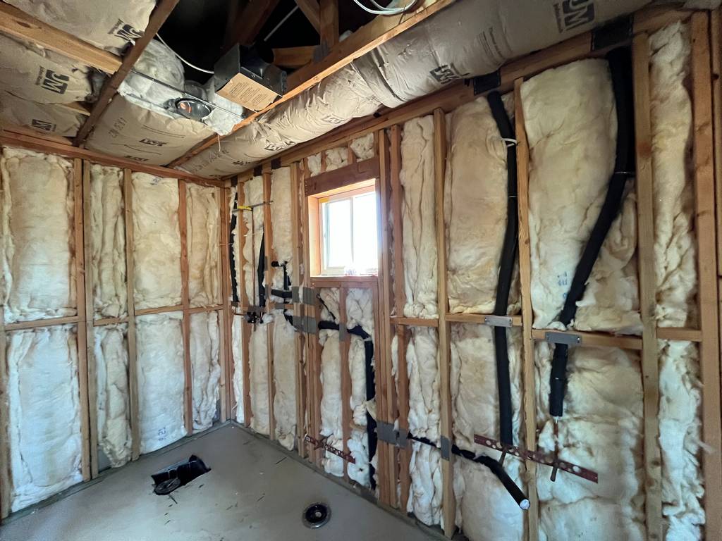fiberglass insulation in the stud walls  along with all the plumbing lines valve fixtures