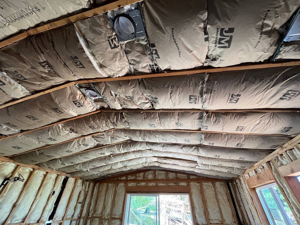 Johns Manville insulation between roofing trusses for superior energy efficiency