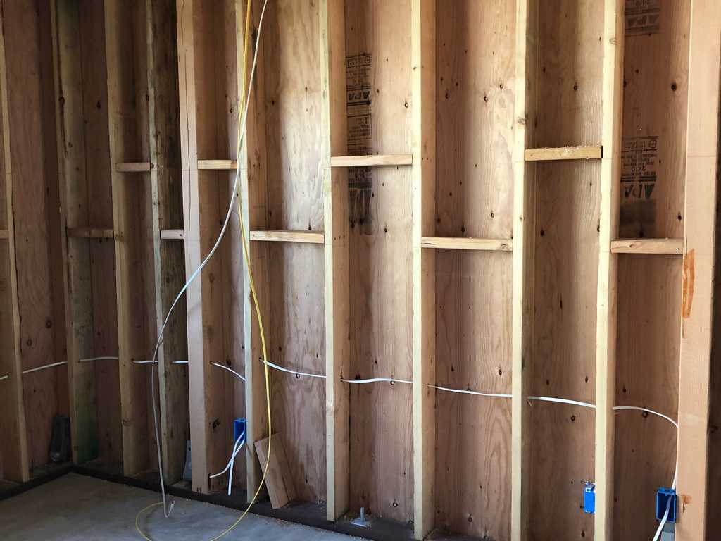 ADU showing wood frame, electrical work ready for drywall