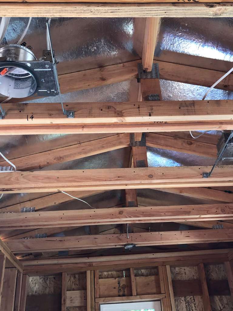 canned-light-fixtures-fastened-to-wood-trusses-on-attached-ADU-2nd-floor-addition