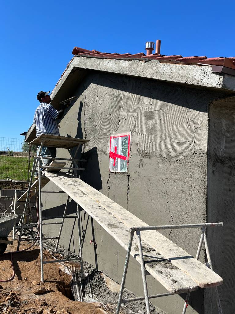 Residential Home Addition: Mason Applying Stucco Scratch Coat