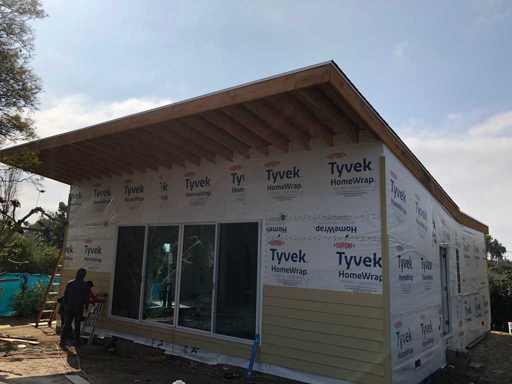 Tyvek HomeWrap getting covered with wood siding