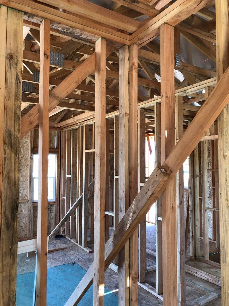 rough framing the inside walls of the home addition