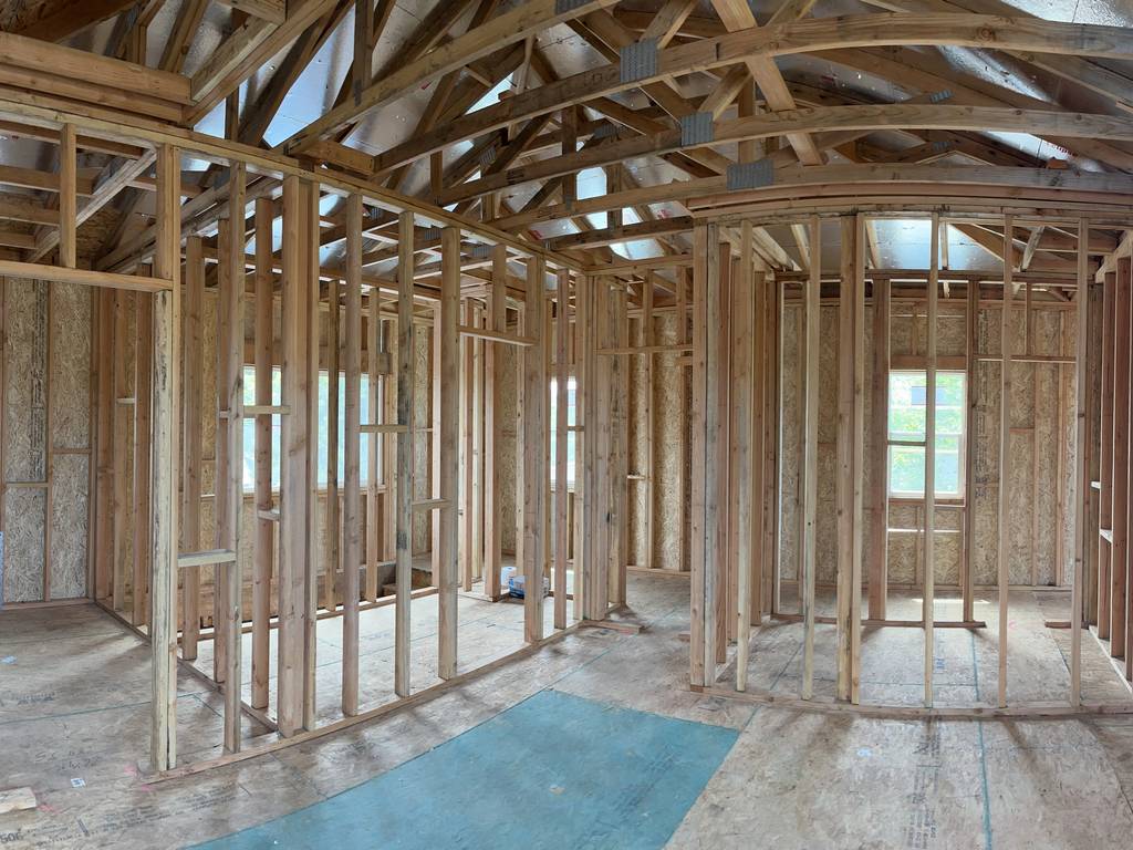 inside the home addition showing rough framing