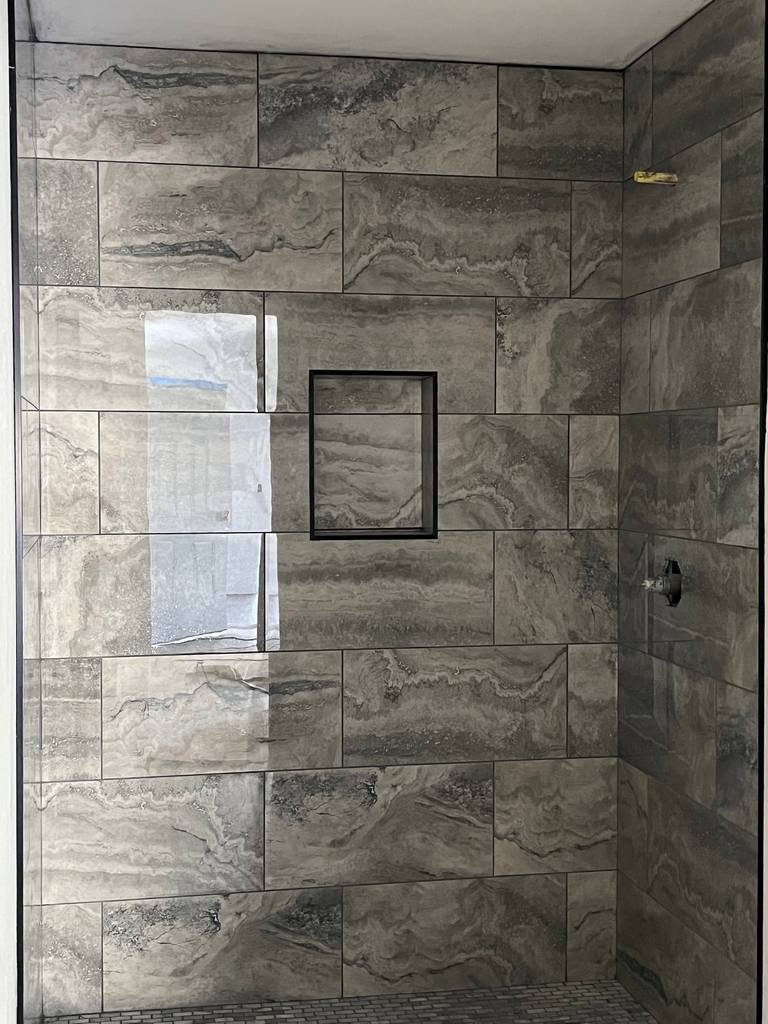 Realistic marble detailing on the new shower walls