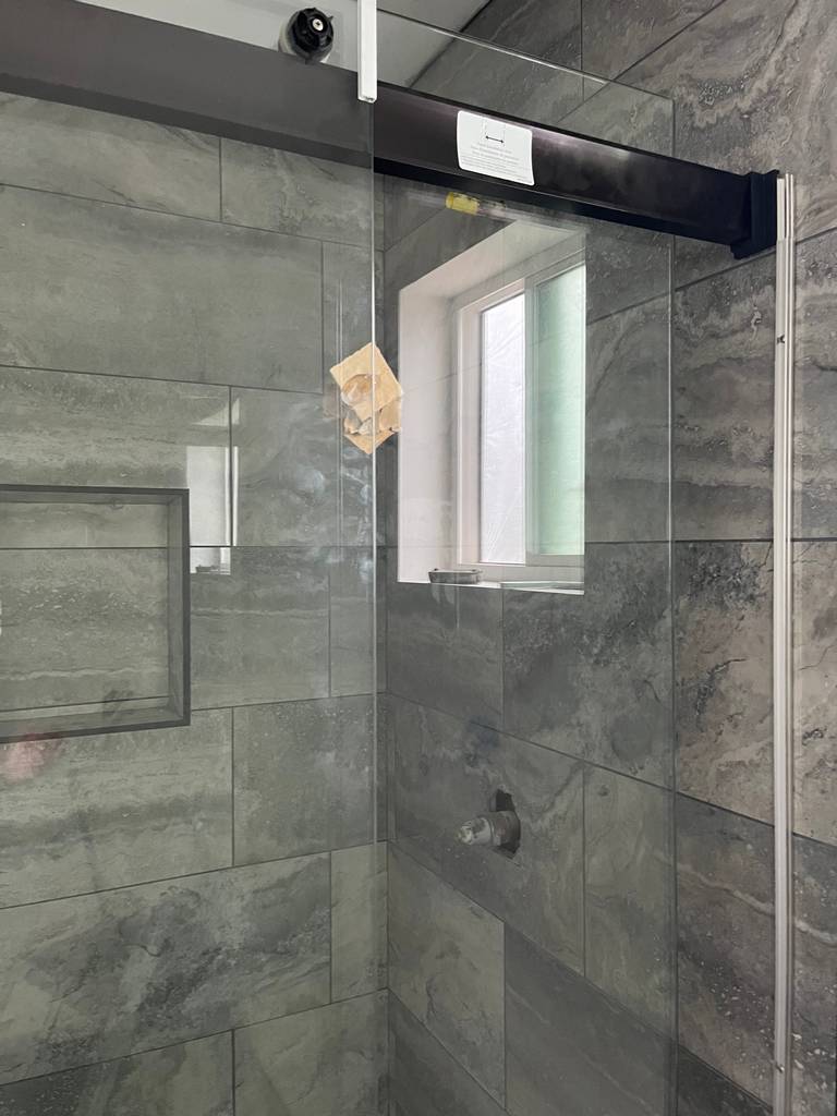 15i_bronze shower-header-complementing-tile-design