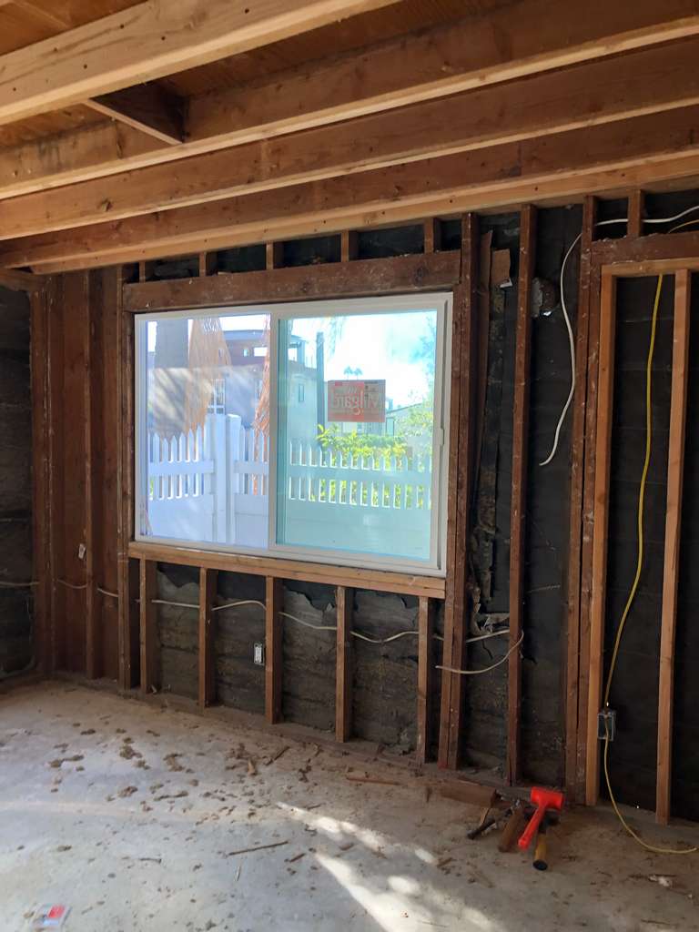 Inside-Stud-Walls-with-new-vinyl-window-on-Remodel-and-Home-Addition